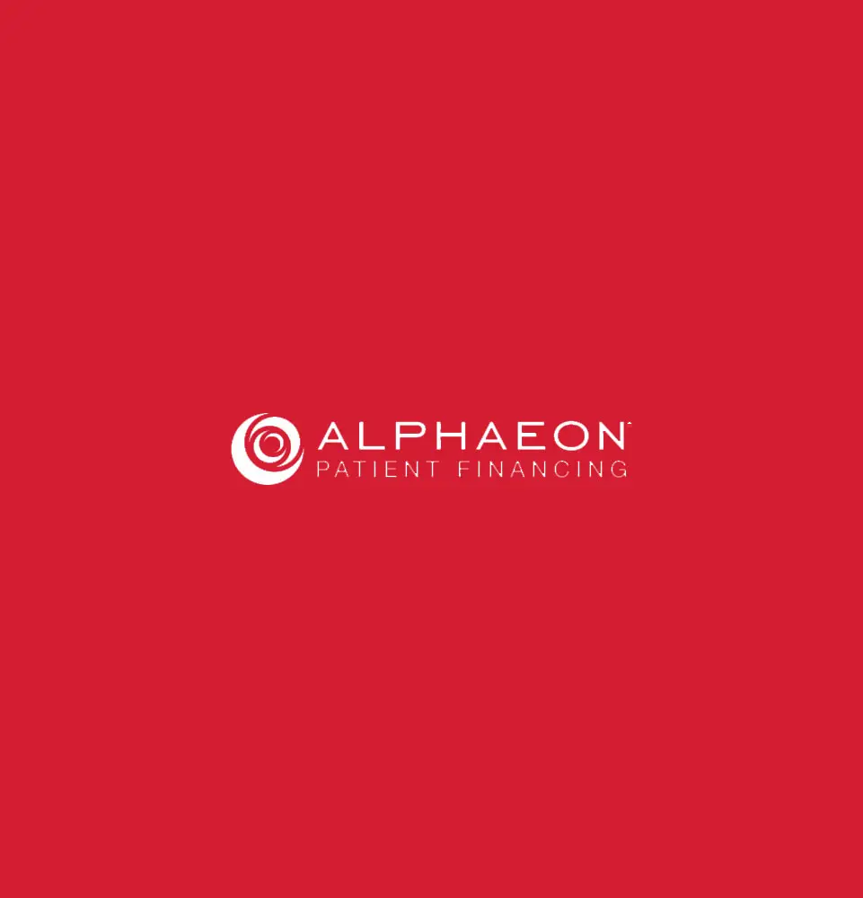 The text reads, "ALPHAEON PATIENT FINANCING" in white, centered on a solid red background. A circular logo is positioned left of the text.