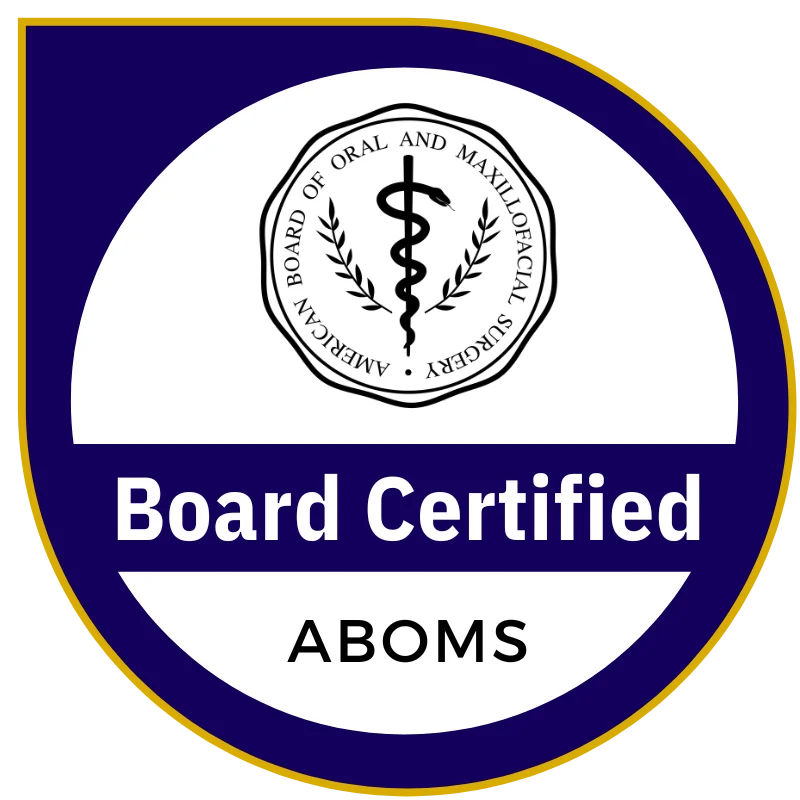 Seal featuring a caduceus symbol surrounded by text, "AMERICAN BOARD OF ORAL AND MAXILLOFACIAL SURGERY." Below, "Board Certified" appears prominently, followed by "ABOMS" in a circular design with a blue border.