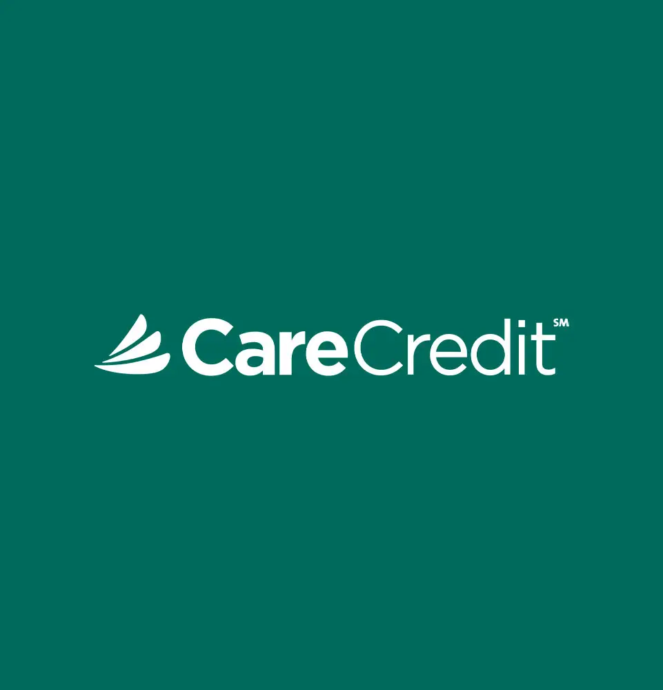 The "CareCredit" logo features white text and a stylized wing-like emblem on a dark green background, conveying a sense of financial service branding.