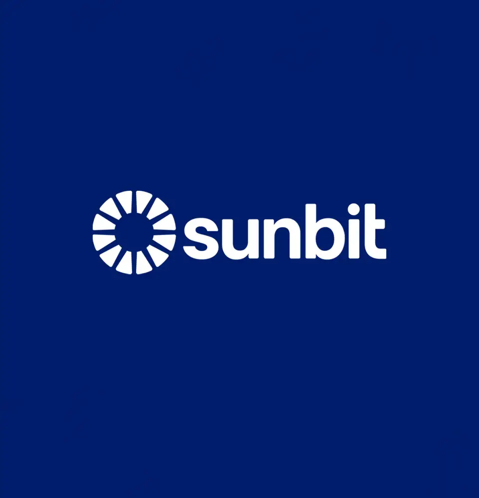 A stylized sun icon with white radial segments appears next to the text "sunbit" in bold white letters, set against a solid dark blue background.